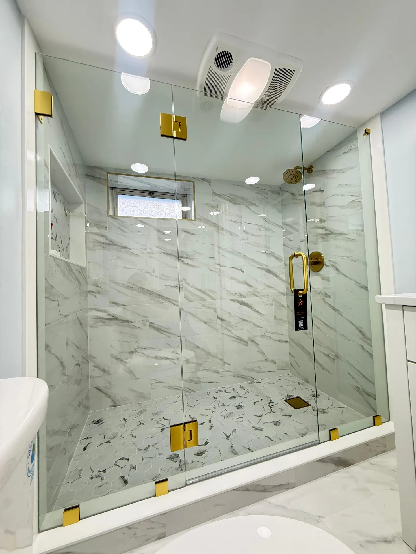 Walk in shower with frameless glass panel