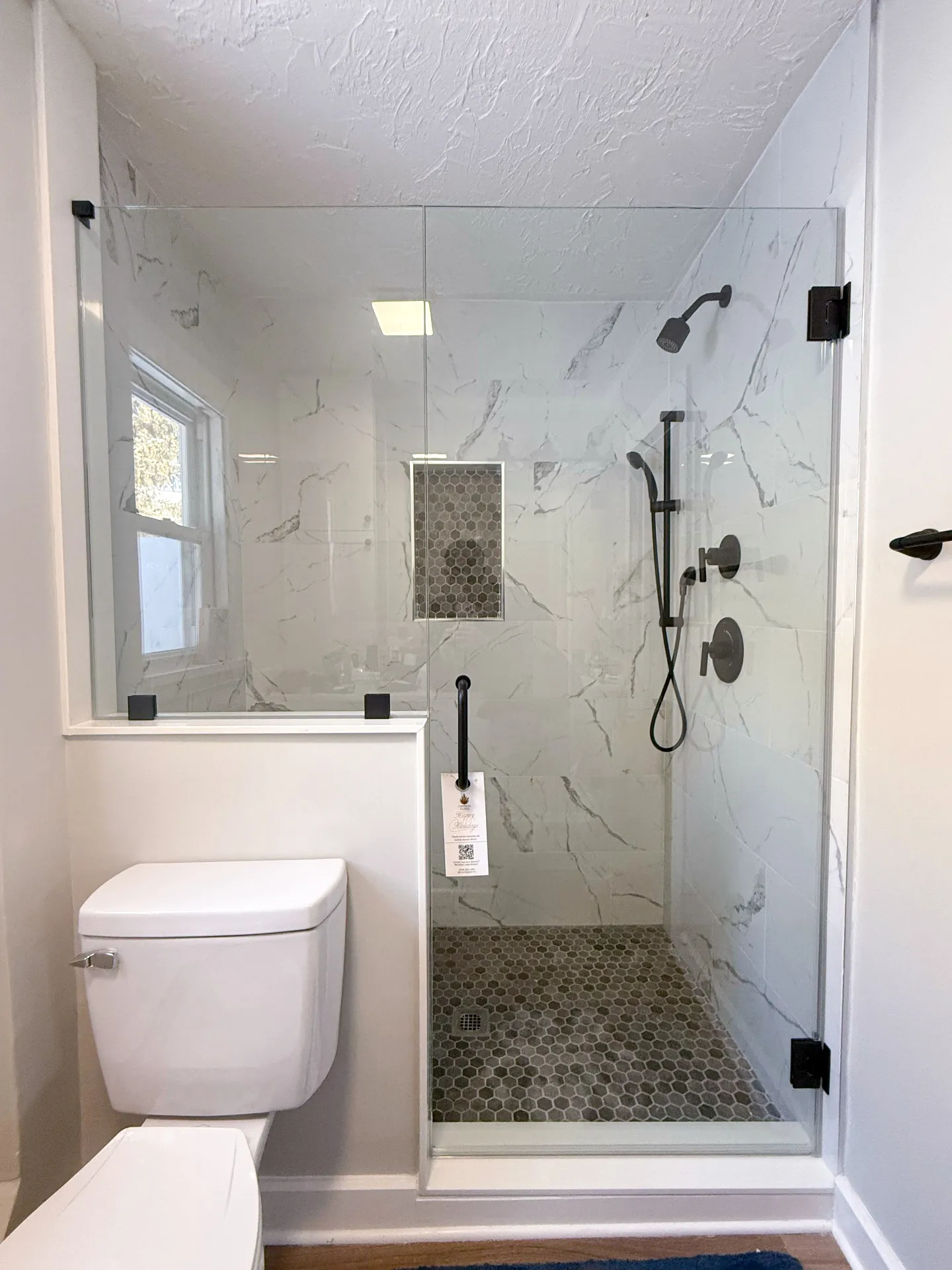 Shower door with hexagon tile floor