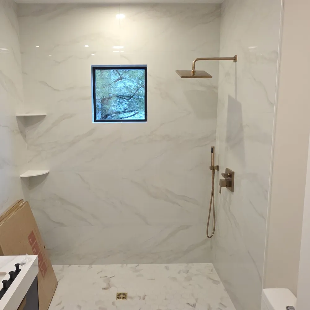 Marble shower with the opening still bare, before the glass went in